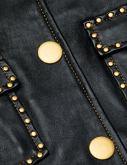 Close-up of gold stud detailing on L’AGENCE Winsome cropped leather jacket