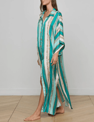 Side view of model in L’AGENCE Wrena Cover-Up Shirt Dress in Light Sage Belt Stripe.