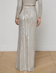 “Back view of L’AGENCE Zeta Sequin Maxi Skirt in shimmering silver swirl sequins.”