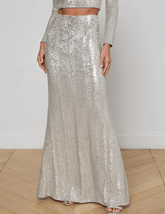 “Front view of L’AGENCE Zeta Sequin Maxi Skirt in shimmering silver swirl sequins.”