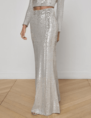 “Side view of L’AGENCE Zeta Sequin Maxi Skirt in shimmering silver swirl sequins.”