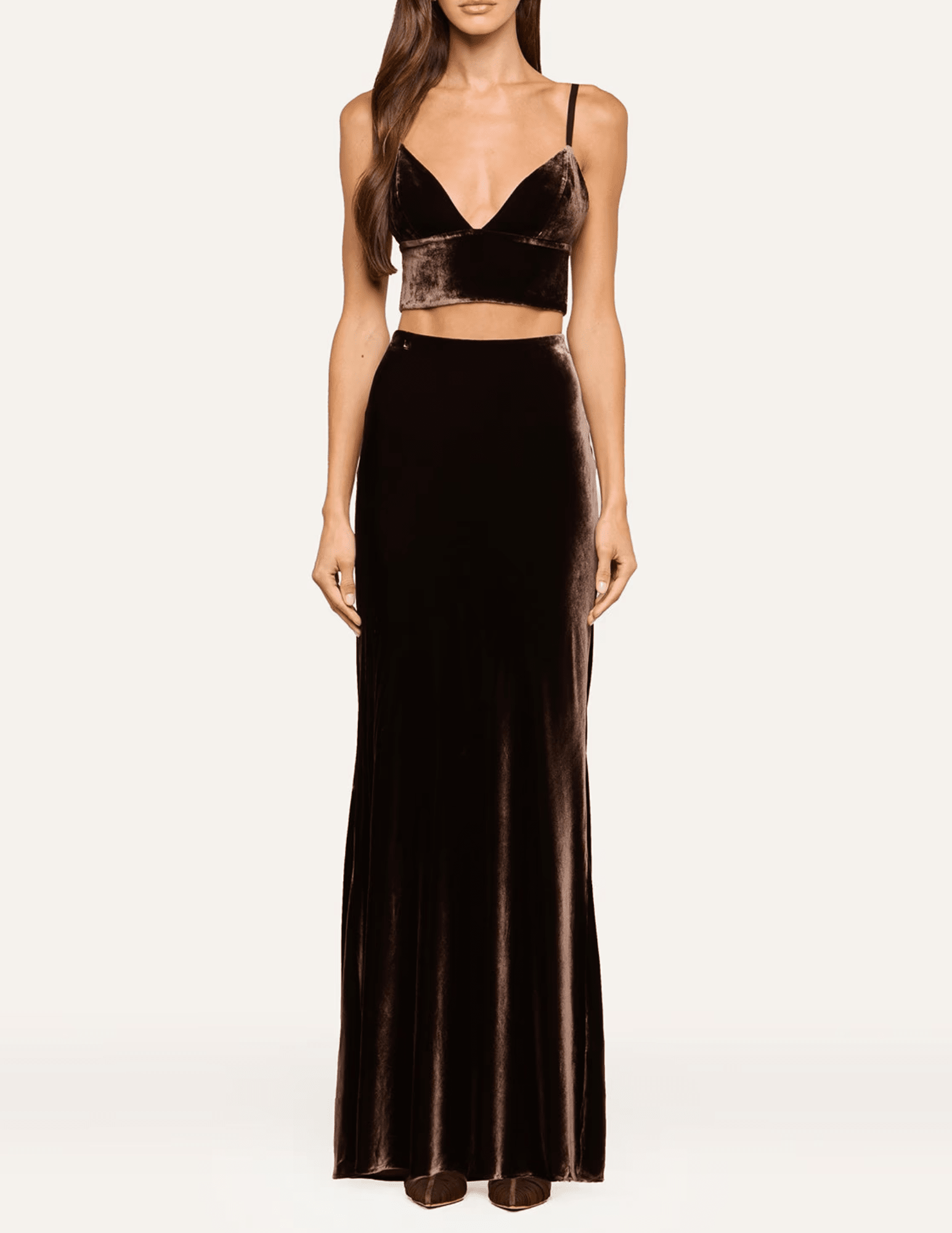 L'AGENCE Zeta Velvet Maxi Skirt in Dark Java styled with a coordinating brown velvet bralette for an elegant evening outfit.