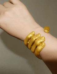 Maison Verrou Lamain Cuff Bracelet in gold on wrist