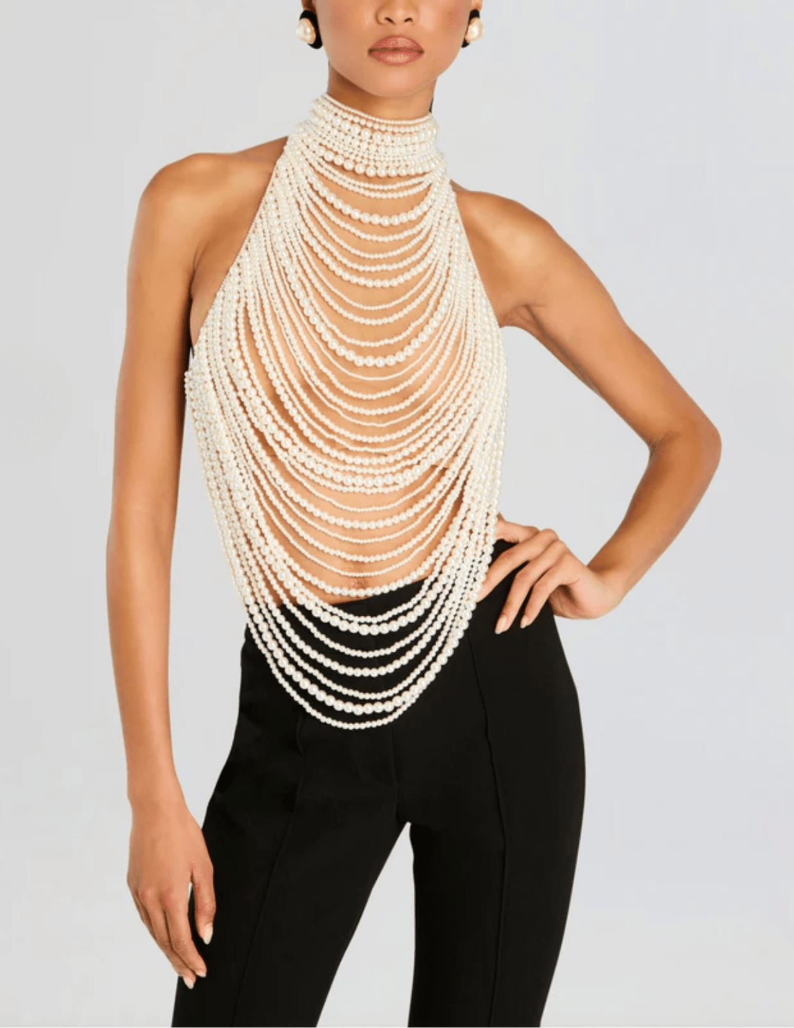 Front view of Retrofête Elsie top featuring open back with pearl strands