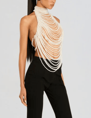 Side view of Retrofête Elsie top featuring open back with pearl strands