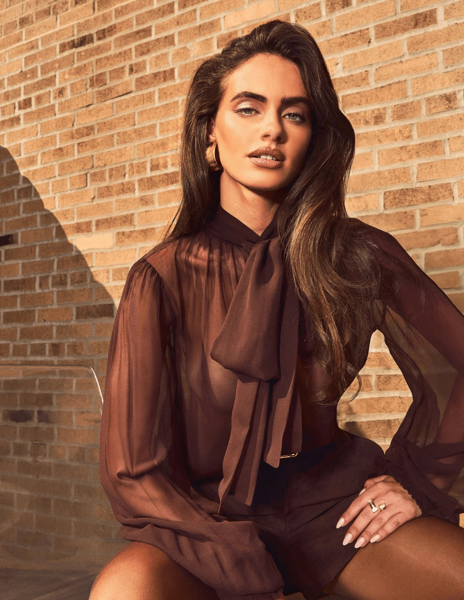 Lifestyle image of Retrofête Hasli Silk Chiffon Blouse in Mahogany