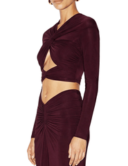 Side view of Ronny Kobo Bebe Crop Top showing its draped twist-front detail and cropped silhouette.
