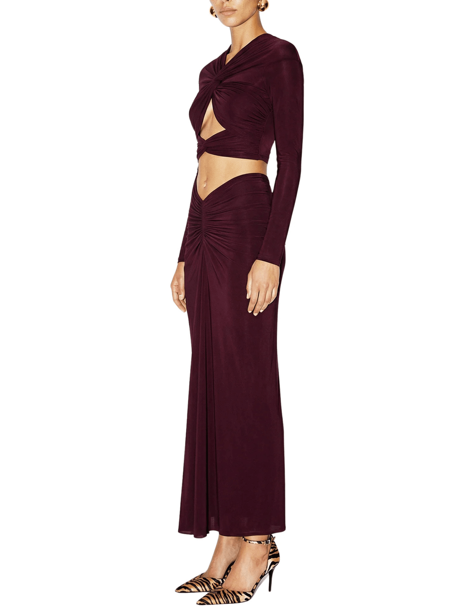 Side view of Ronny Kobo Brogan Midi Skirt showing its slim silhouette and draped jersey fabric.