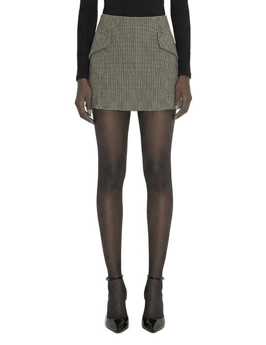 Front view of Ronny Kobo Renelle plaid mini skirt styled with a black turtleneck and sheer tights.