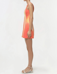 Simkhai sleeveless mini dress orange red sunset pattern fitted silhouette side view