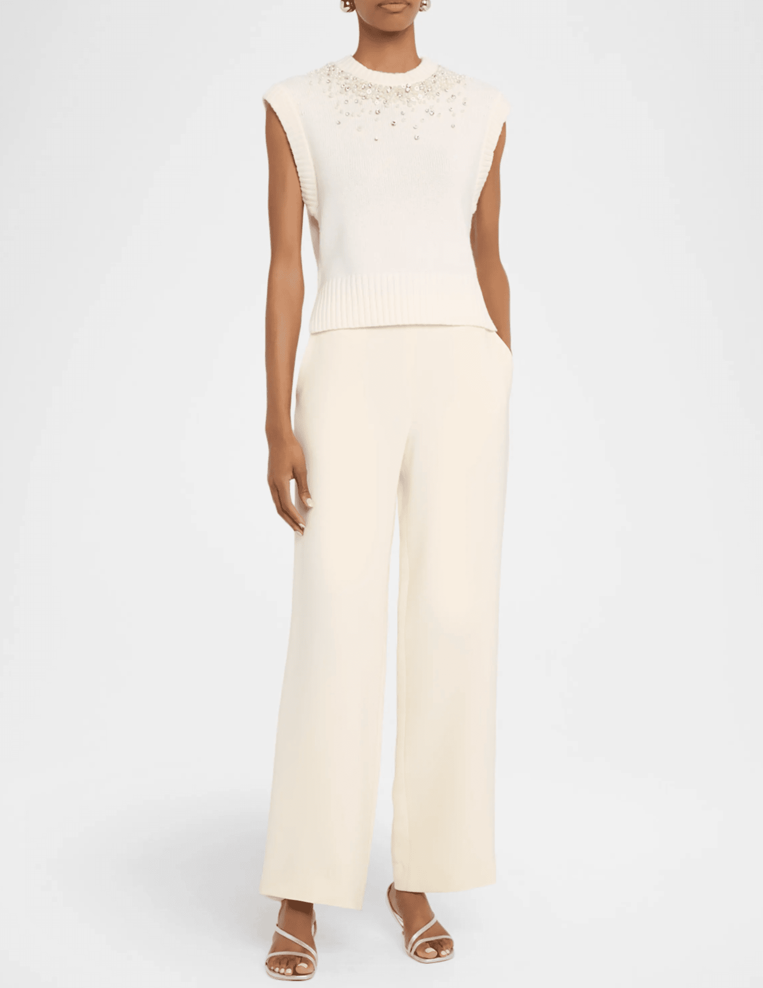 Model wearing SIMKHAI Candra Ivory Embellished Sweater Vest