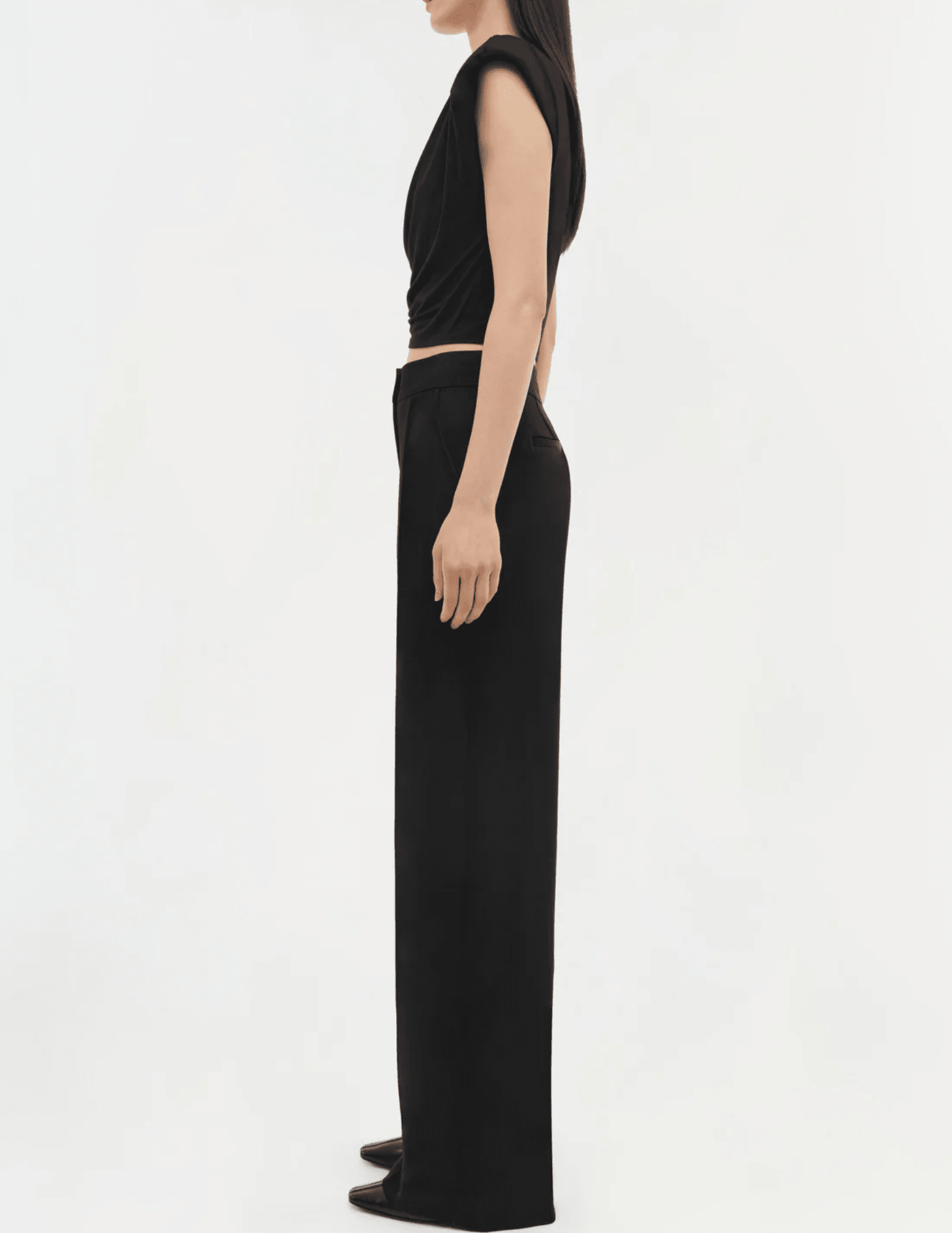 Side view of black cap sleeve crop top with padded shoulders