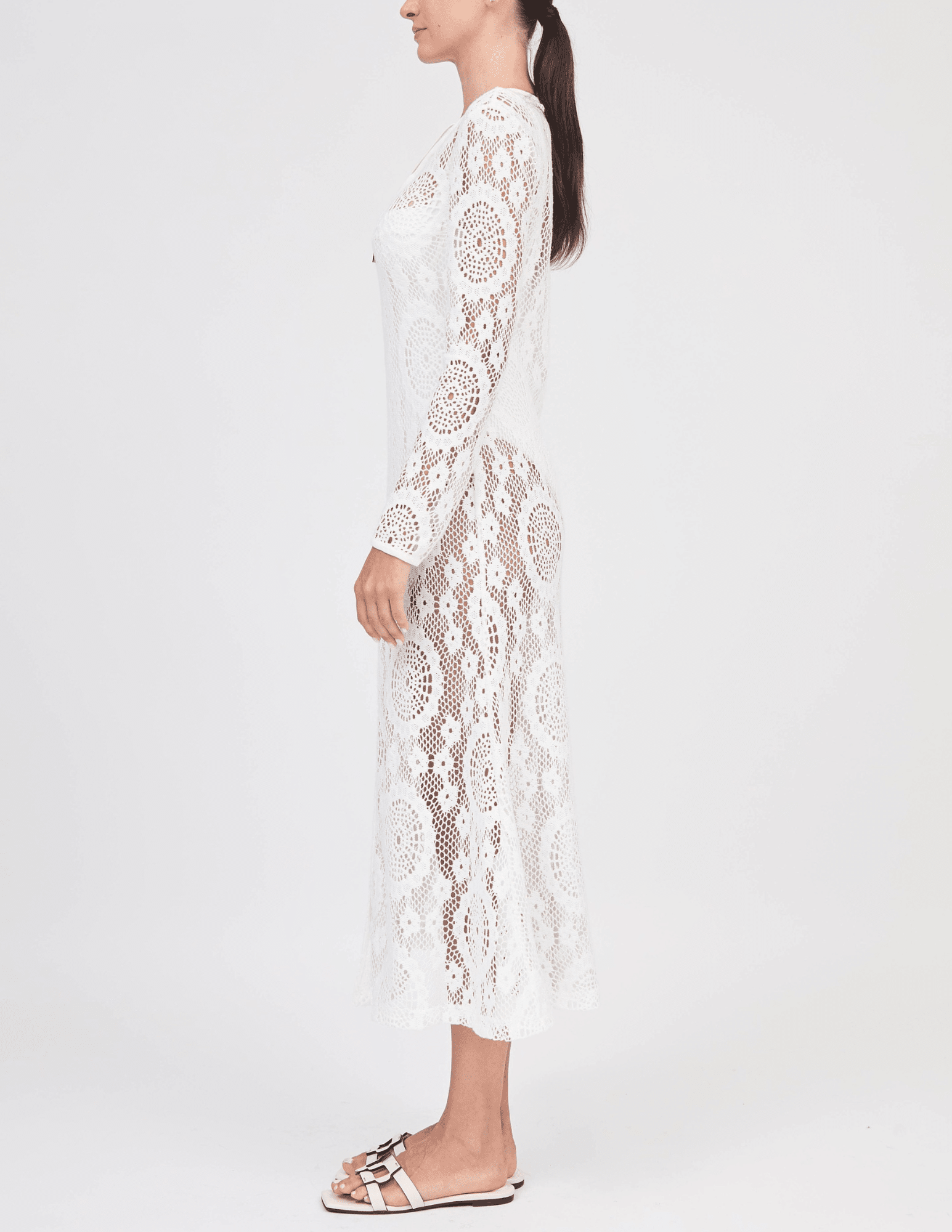 Side view of white crochet long-sleeve cover-up dress