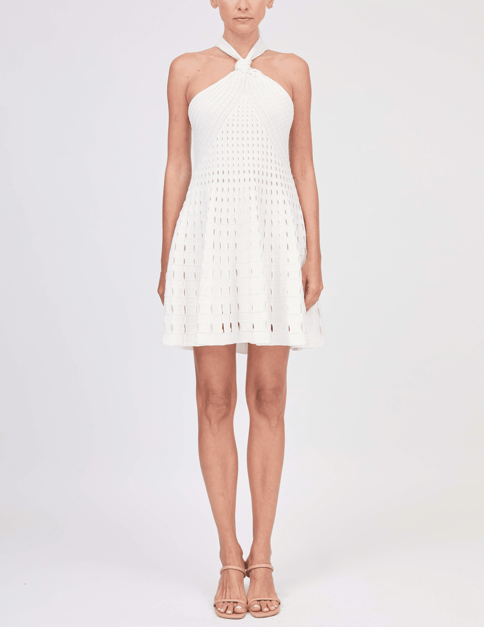 Front view of ivory knit halter mini dress by Simkhai