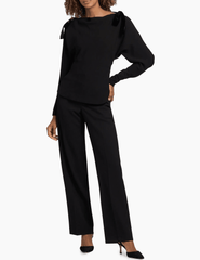 Model wearing SIMKHAI Marlee Black Shoulder Tie Blouse