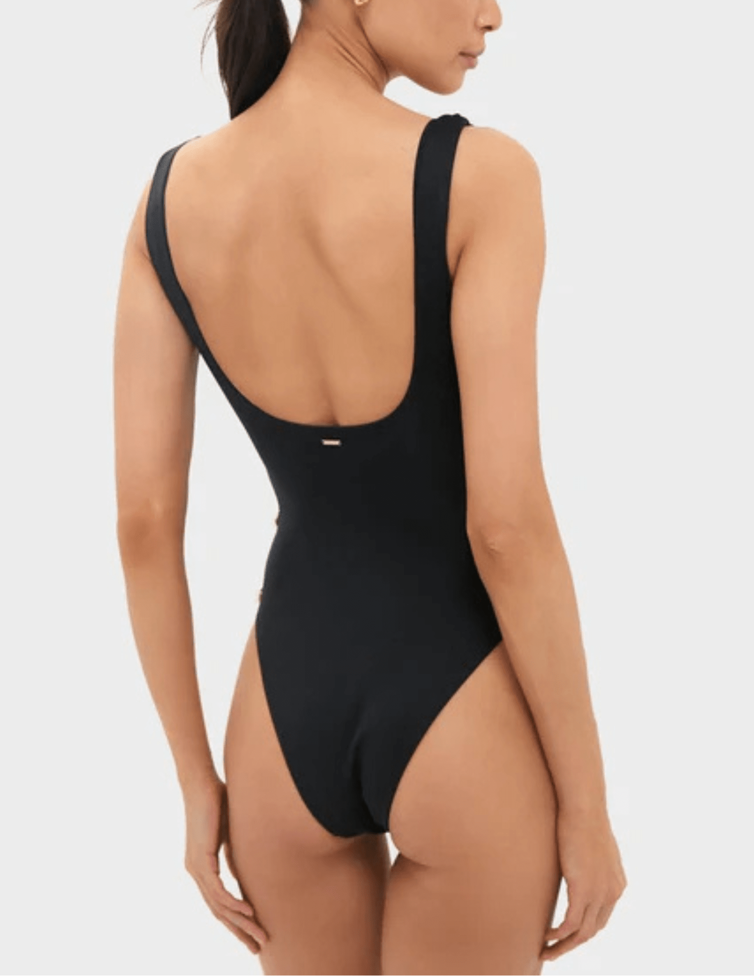 Back view of Simkhai Mona black scoop back swimsuit