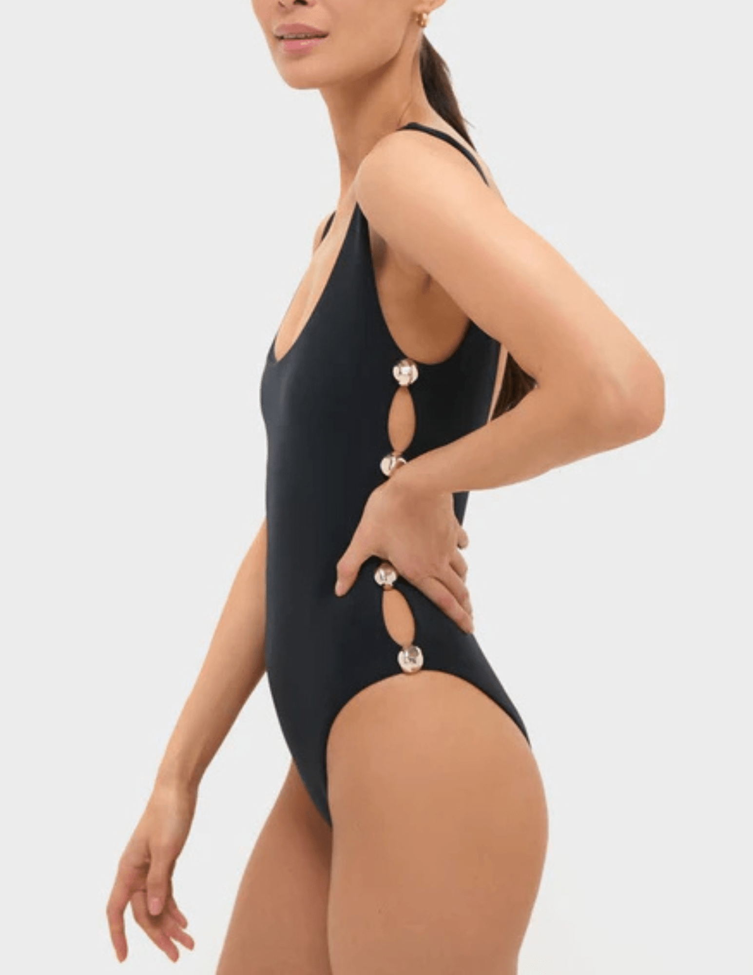 Side view of Simkhai Mona swimsuit with gold stud details