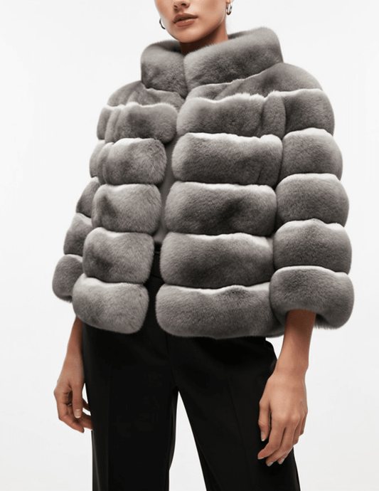 Model wearing Steven Dann Lissy Rex Fur Jacket in Natural with stand collar and short sleeves